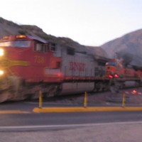 A BNSF Warbonet leads a train at Swarthout Cyn Road on Cajon Pass. 

Note: 2nd unit pouring out smoke.