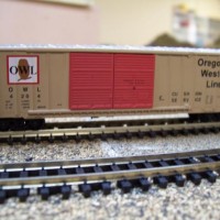 An OWL logo was developed to accent some Oregon Western Lines rolling stock in addition to the "arrow" logo.  Most of the Oregon Western Lines logos and paint schemes that you see were designed, custom painted, and decaled by Everett King. The OWL boxcars were a Micro-Trains special run utilizing the designs.