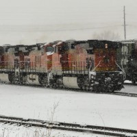 Dash 9s move thru the yard in a snow squall