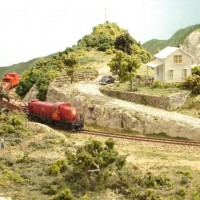 Sand Springs Railway - Katy engine passing through the rural area. The farmhouse is scratchbuilt.