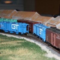 Here is a closeup of my freight cars parked in front of my lumber company.