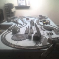 Layout showing 1 inch foam board on subflooring. this shows turntable placement, small town, main station placement and single track placement.