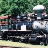 The ES&NA RR Steam Locomotive #1, Locomotive #1 was built in 1906 by the Baldwin Locomotive Works, Philadelphia, Pennsylvania. Serial #29588, It was and is a wood burner. It is a 2-6-0 (Mogul) and, Engine only, Weight 75,000 pounds. it will produce 200 pounds of steam pressure (p.s.i.) and 12,00 pounds of tractive effort (power). Locomotive #1 was originally used in the Northeast Texas Lumber industry, there it burn yellow pine slab wood. Later when part of The Scott & Bearskin Lake Railroad in Scott, Ark. it burned sycamore and other local hard woods. Here in Eureka Springs it burns white and red oak, and hickory. One of the last operational wood burner in the United States, it consumes up to 1-1/2 to 2 cords of Ozark hardwood in a full day's operation. Its cabbage-head stack is unique and was designed to serve as a spark arrester. Retired in the late 1990's because of a an expensive boiler re-build mandated by the state boiler inspector.