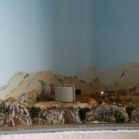 completed scenery in field, with lit lamp
