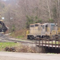BCC's Ex C&O GP9 which used to belong to several other companies now is BCC 6020 sits on its track, with the single car loader in the background.
