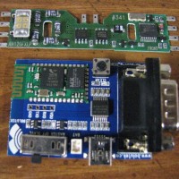 >$10 Bluetooth Serial I/F Board on its development board below DCC decoder board.