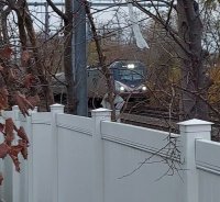 Amtrak AC  On Grey November day Just past Hyde Park cropped.jpg