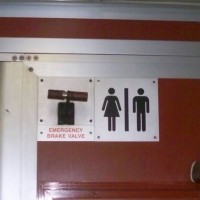 Emergancy_break_and_Bathoom_Sign_Juxatposed