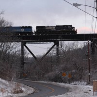 NS9288 leading Southbound grain train over Devou trestle, Ludlow, KY, 1-30-