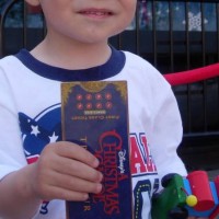 Lorenzo shows off his ticket.