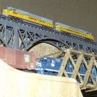 SD50s crossing a Steel Arch Bridge