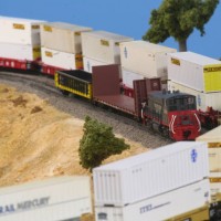 051227 SP work train (n scale) passing Santa Fe hotshot on the loop siding