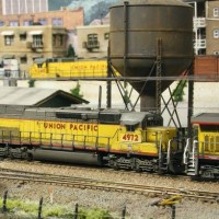 A UP SD45T-2 follows an ES44AC through town - BNSF BenZach Sub