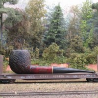 CSX pulpwood car with 'pipe' load