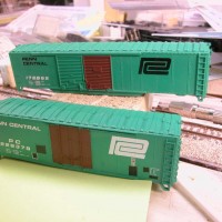 Workbench Two Penn Central Boxcars in Progress