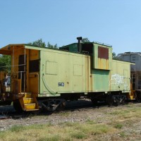 former BN caboose relegated to shoving-platform, Verdigris siding, OK