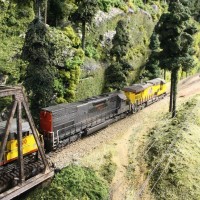 UP ES44, former SSW SD45-T2 (NREX), and a UP SD60M pull freight on the BNSF