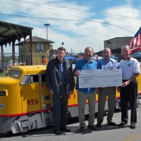 UP Foundation presents the Museum a check.