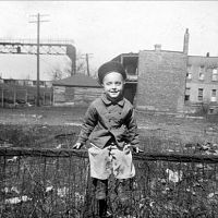 Me, sitting on fence with Rock Island Mainline in Background