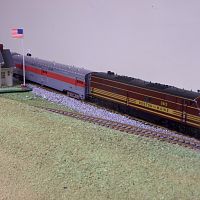 Proto2000 E unit leads train of IHC streamliners
