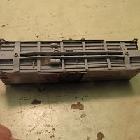 Under carriage painted with light gray auto primer from a rattle can