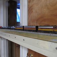 Athearn F7 ABA lashup on point of unit tank car train on the bathroom straight