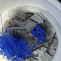 Gray 3D printer Fails cut up for scrap metal loads; Blue Fail will be painted and used as scrap pipe load