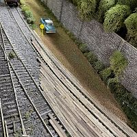 Rock retaining wall, wooden grade crossings