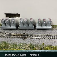 While the loco switches other areas of the mill, the yellow hot ingots cool and turn yellow-orange