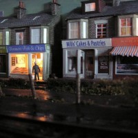 Shops are Metcalfe card kits - 00 scale. Wet look is varnish.