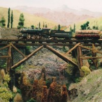 Log train on the wooden trestle over the endolyne ravine.