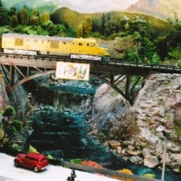 DL109 leads U.P. passenger train over bridge at Millers Falls.