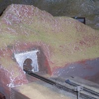 As you enter the layout room, the first module that you encounter is the "duck under" module. The first test for your imagination is to assume that the tunnel to your left is the Poison Creek Tunnel on the Oregon & Northwestern.