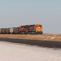 An eastbound coal drag parallels US Hwy 34 west of Danville, IA. January 21, 2009.