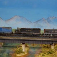 Three of Rob Mallett's Geeps on a bridge.