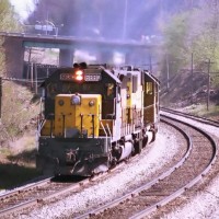 CNW SD40 2 6880A rolls past the Dresbach Dam.