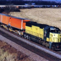 CNW 7031 on Bertram Curve with a short intermodal, Bertram Iowa.