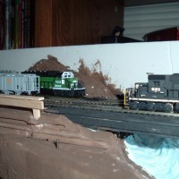 My NS#6123 SD40-2 going over the scatch built bridge over the river I was planning to finish