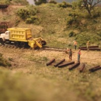 Sand Springs Railway - Track Crew at Muskogee - The ballast truck was built from prototype pictures.  Kitbashed from 2 trucks, a dumpster, HO passenger car vents and styrene.