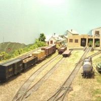 Sand Springs Railway - Yard Tracks - ballast and dirt were free, all you do is dig and sift.  The engine house has clear plastic roof (dusted with flat black paint) looks like tar roof.  The overhead track lighting illuminates the interior.