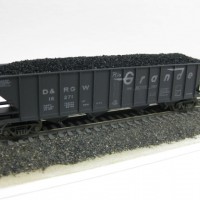 Trainworx D&RGW Quad hopper - I have several trains of these & they are a great looking car. I have weathered all of these slightly different degrees & methods so that a string of them looks really cool > like the protoype. 
I sand down the moulded coal load so it sits lower and glue some "Chuck's Ballast" N scale coal on top