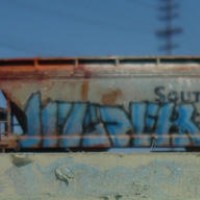 Hand painted and airbrushed one of a kind scale freight cars based on actually 'tagged' cars.  Each are aged and weathered to various degrees, and the graffiti is airbrushed (No Decals) . This photo batch are all HO scale and photographed outdoors in Long beach harbor area on a small diorama.