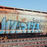 I hand painted and airbrushed one of a kind scale freight cars based on actually 'tagged' cars.  Each are aged and weathered to various degrees, and the graffiti is airbrushed (No Decals) . This photo batch are all HO scale and photographed outdoors in Long beach harbor area on a small diorama.