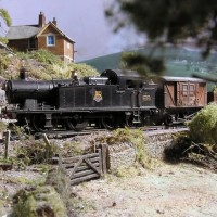 56 Class tank engine after crossing the river. British 00 scale