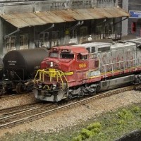 Rode Hard, but not put away yet... ATSF Dash 8-40CW (Atlas) runs through the industrial section of town on the BNSF BenZach Sub.  I weathered this one heavily using a thin black wash, Dull Coat, Rubbing Alcohol, and silver paint (over the "SANTA FE" logo).  Although I used a distinctly different method, I was inspired to "beat this one up" after seeing an HO-Scale Dash 8 that was done by professional modeler Pelle Soeberg.