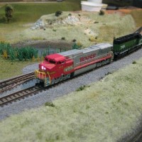 How to make a Bachmann run like a Kato.  Chop it's guts out and hook it up to one.