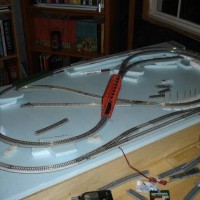 Early layout stage with Unitrack and Woodland Scenics Risers.  Because of the small layout size a short trains I used 4% grades and have had no problems.