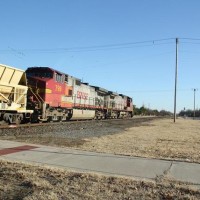 Couple of great looking WB Dash-9s pulling a string of dump cars_12 20 09_Norman, OK
