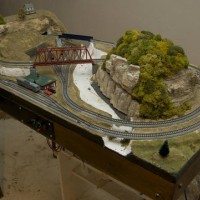 Vegetation grows on Mount Baldy and snow melts off the Tunnel Cliffs
