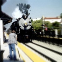 Barellin' through at 65 plus...
Okay, so this the real thing, not a model, but certainly an inspiration. I took this photo of AT&SF 3751 at speed in Claremont CA, on the old Second District, on the ocassion of re-dedication of the old Santa Fe San Bernardino depot. She never looked, sounded or smelled so good...:)